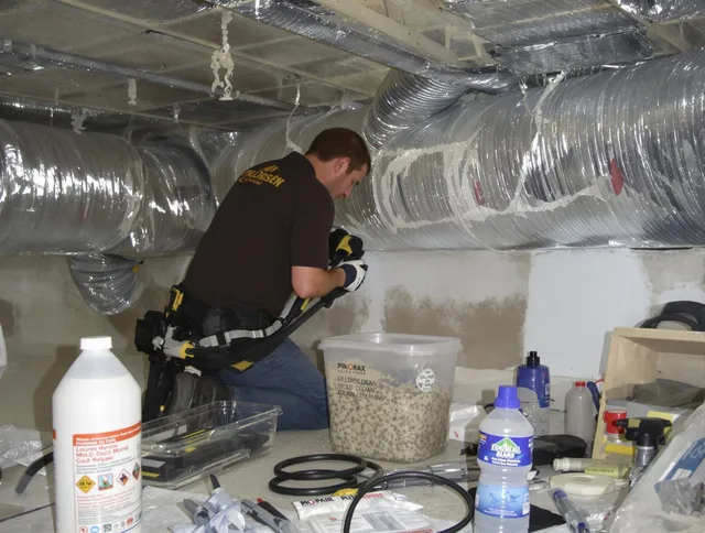 Acushnet Air Duct Cleaning specialist performing professional mold removal from air ducts in Acushnet