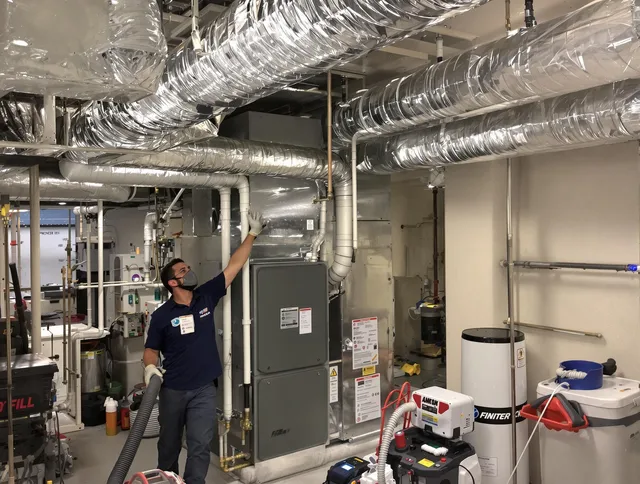 Acushnet Air Duct Cleaning specialist performing thorough furnace duct cleaning in a Acushnet residence