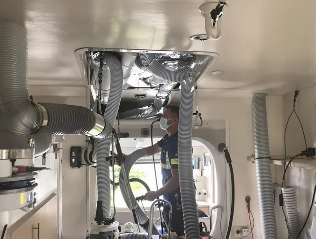 Acushnet Air Duct Cleaning specialist performing precise mobile home duct cleaning in Acushnet