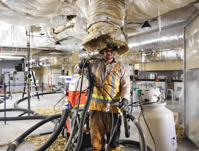 Professional vacuum insulation removal by Acushnet Air Duct Cleaning expert in Acushnet